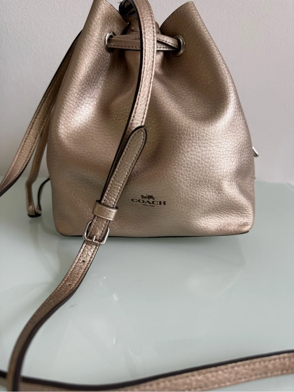 Coach Metallic Rose Gold Leather Drawstring Crossbody Bag